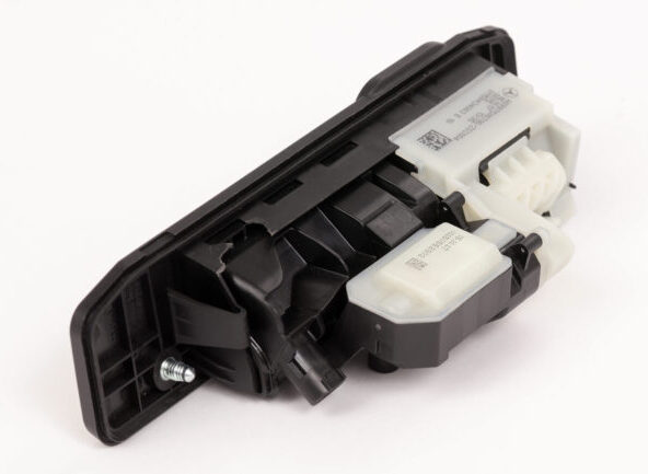 Automotive plastic module with integrated connectors and housing components, joined by laser plastic welding.